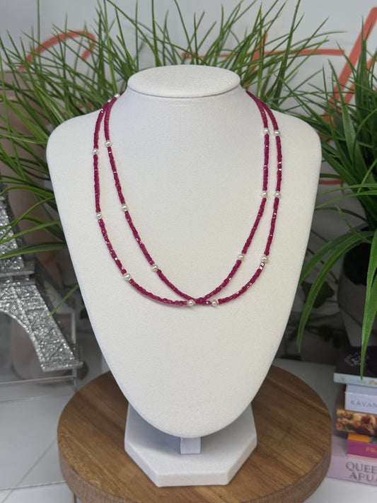 Ruby necklace with faceted beads and pearl details. 17.5-18.5” adjustable gold plated chain.